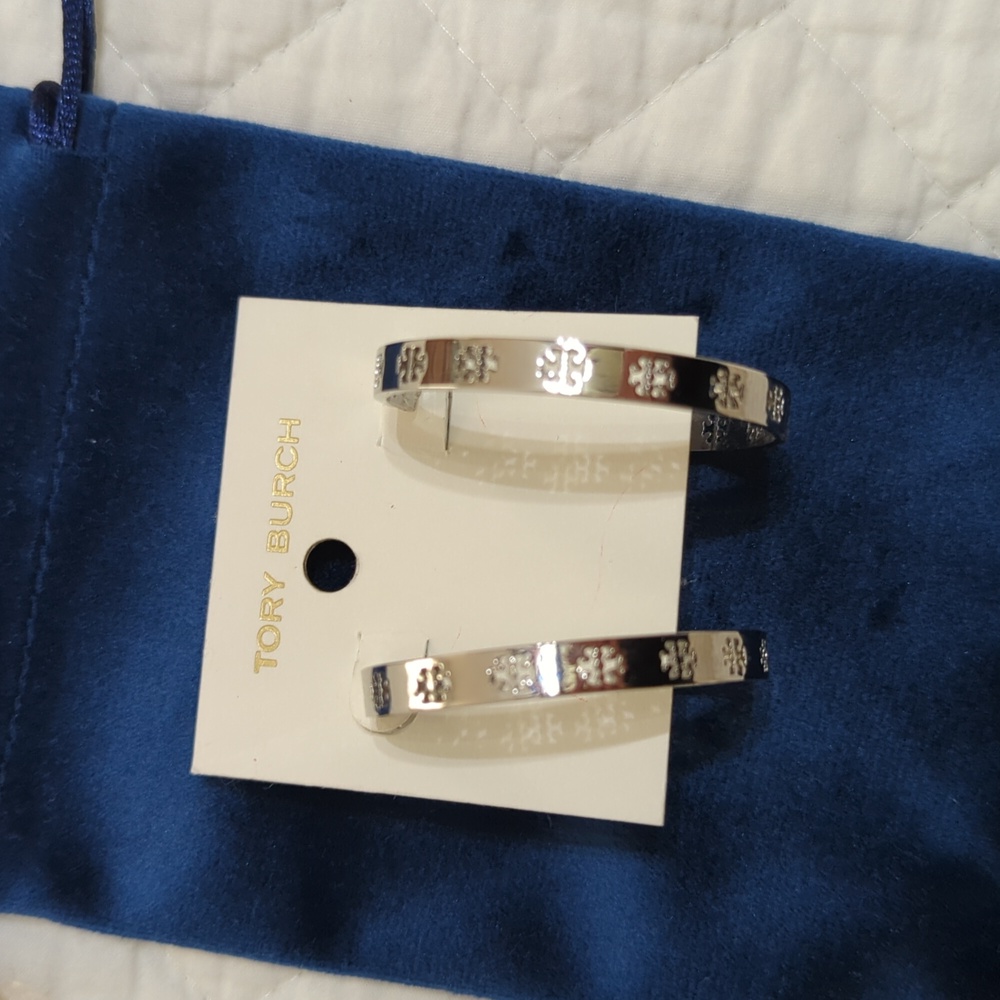 Tory Burch cut out silver hoop earrings. 2 inch.